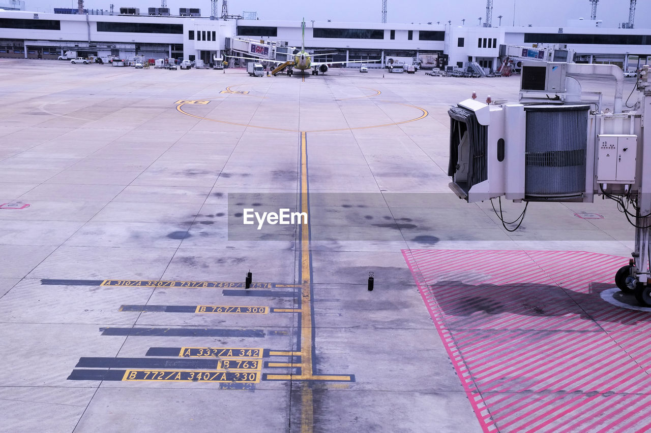 AIRPLANE ON AIRPORT RUNWAY