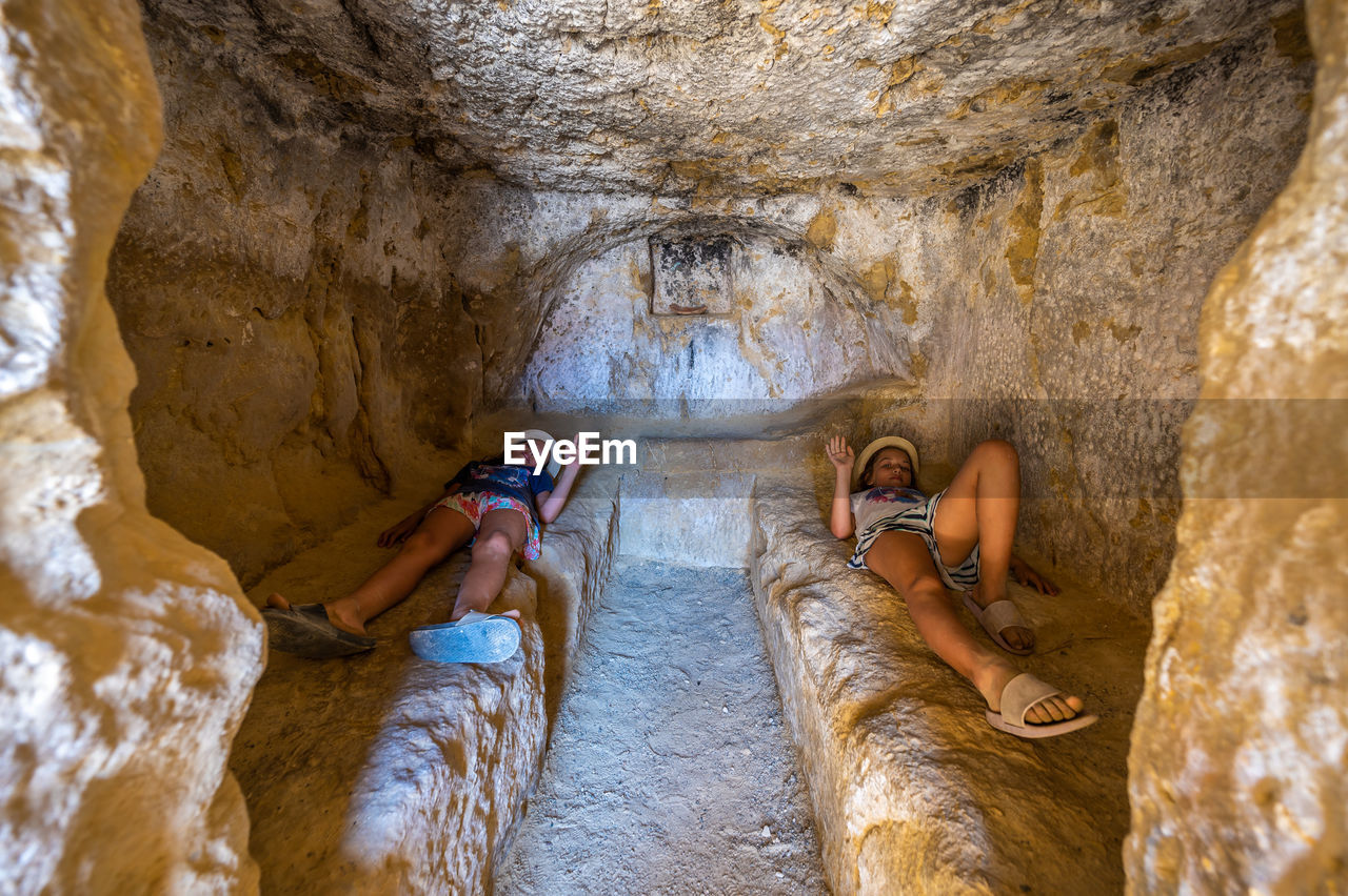 high angle view of man standing on rock formation