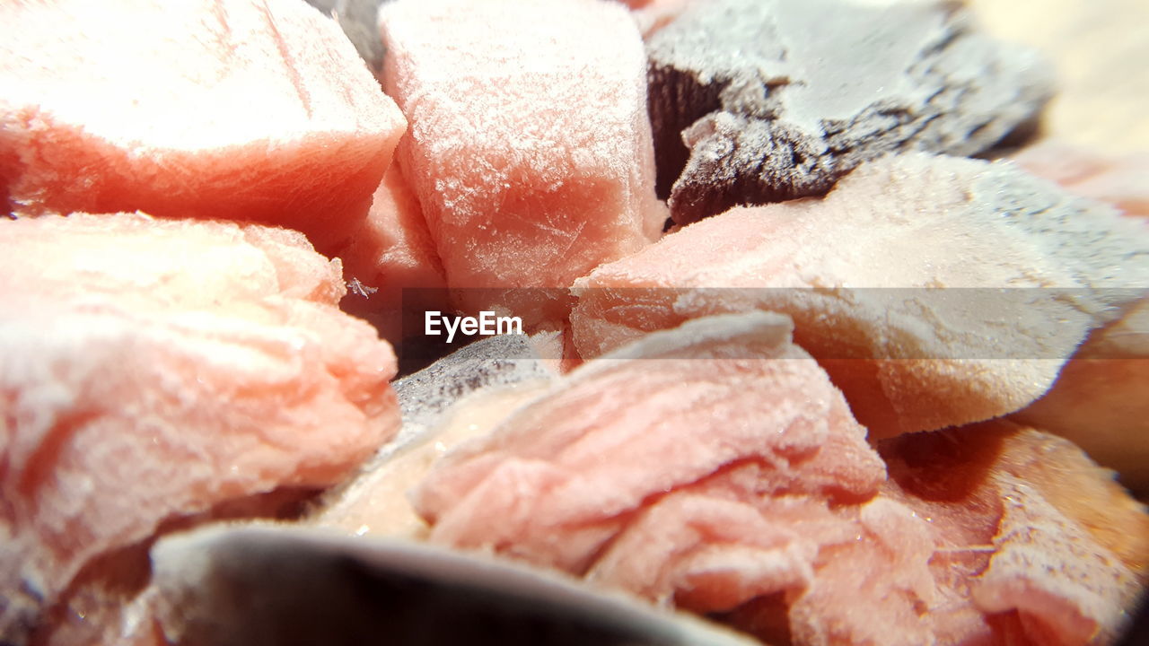 CLOSE-UP OF ICE CREAM IN CONTAINER