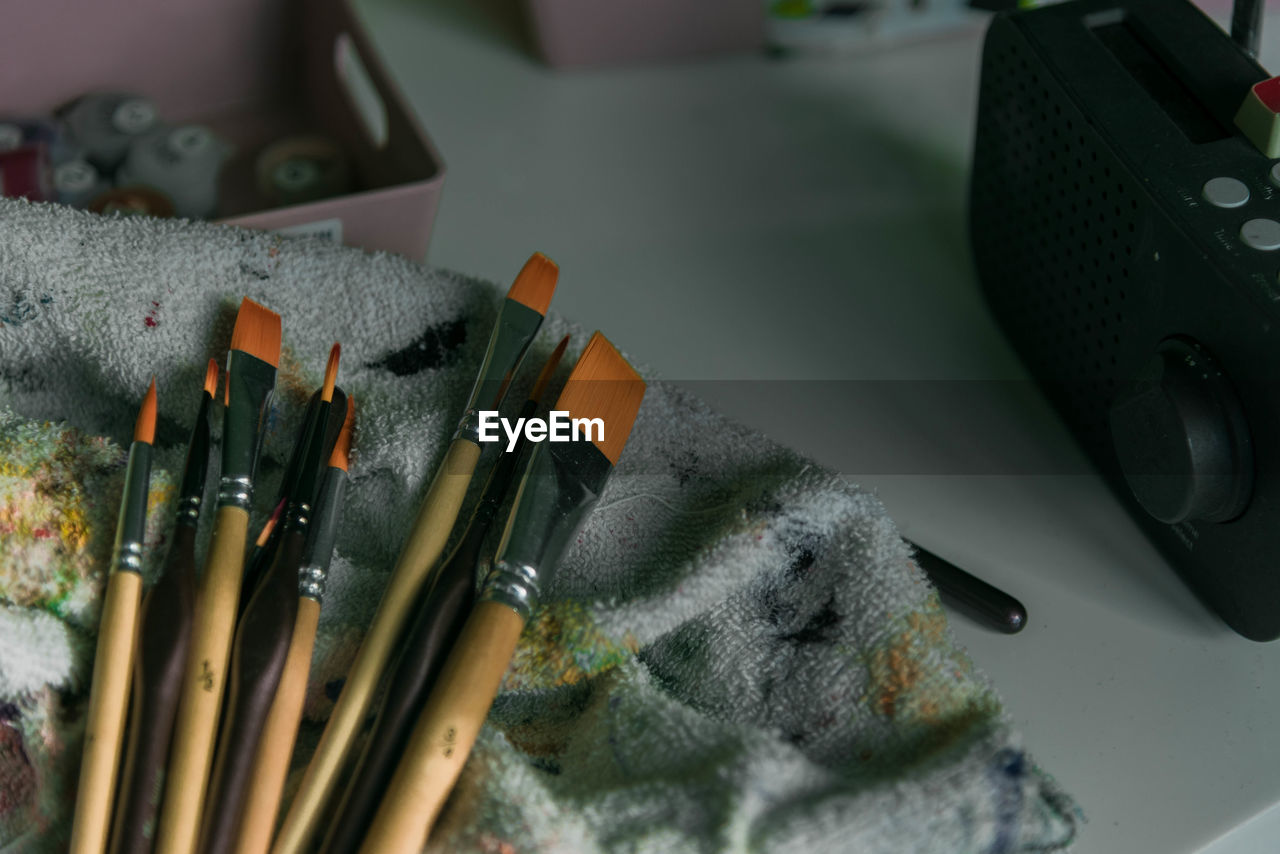 High angle view of paintbrushes on table