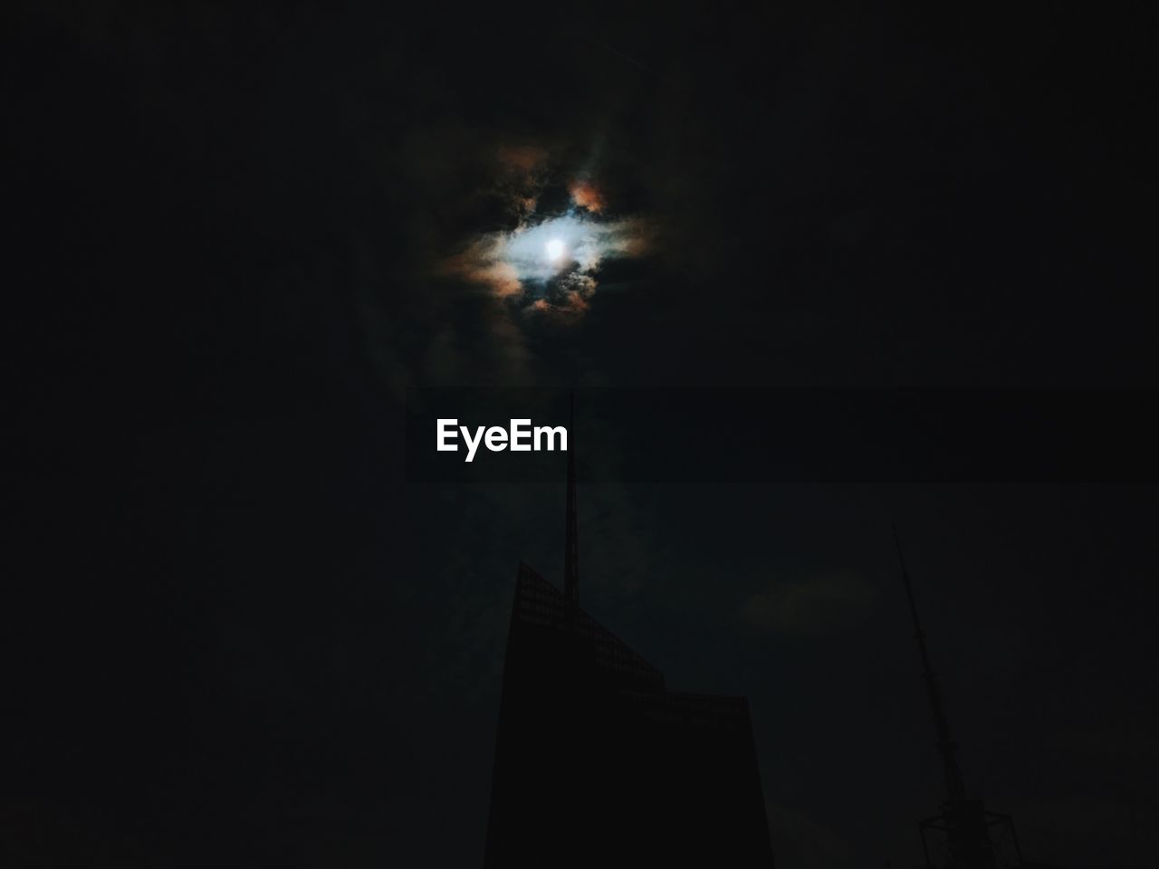 Low angle view of building against sky at night