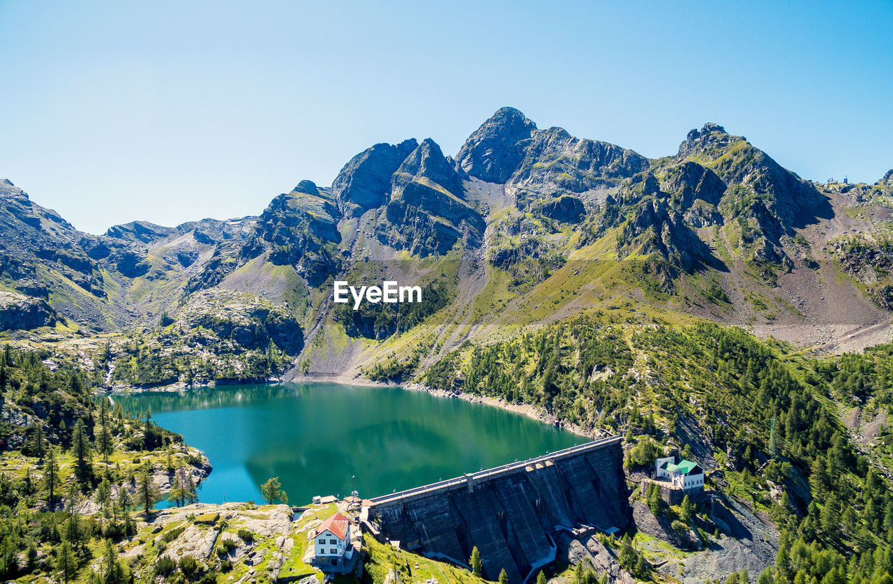 SCENIC VIEW OF MOUNTAINS AGAINST CLEAR BLUE SKY