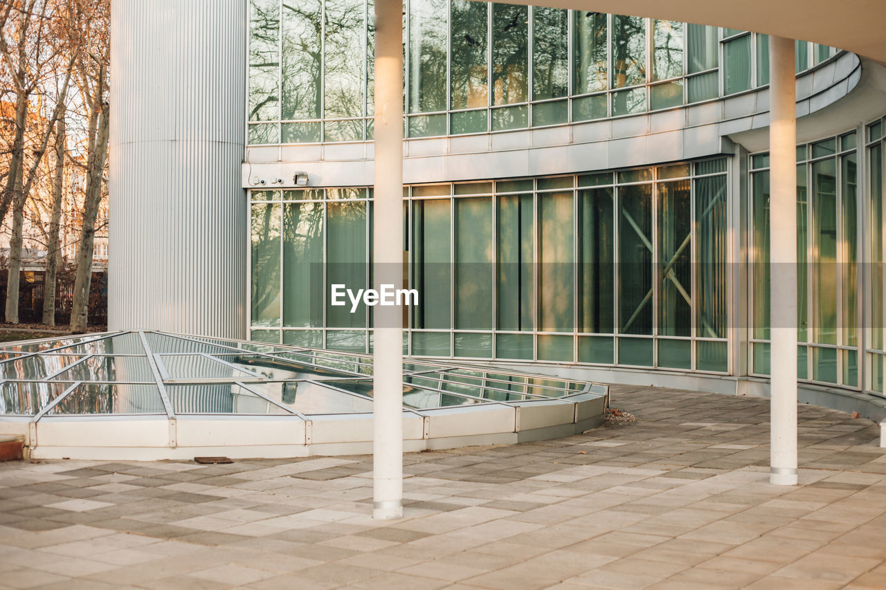 MODERN BUILDING SEEN THROUGH WINDOW