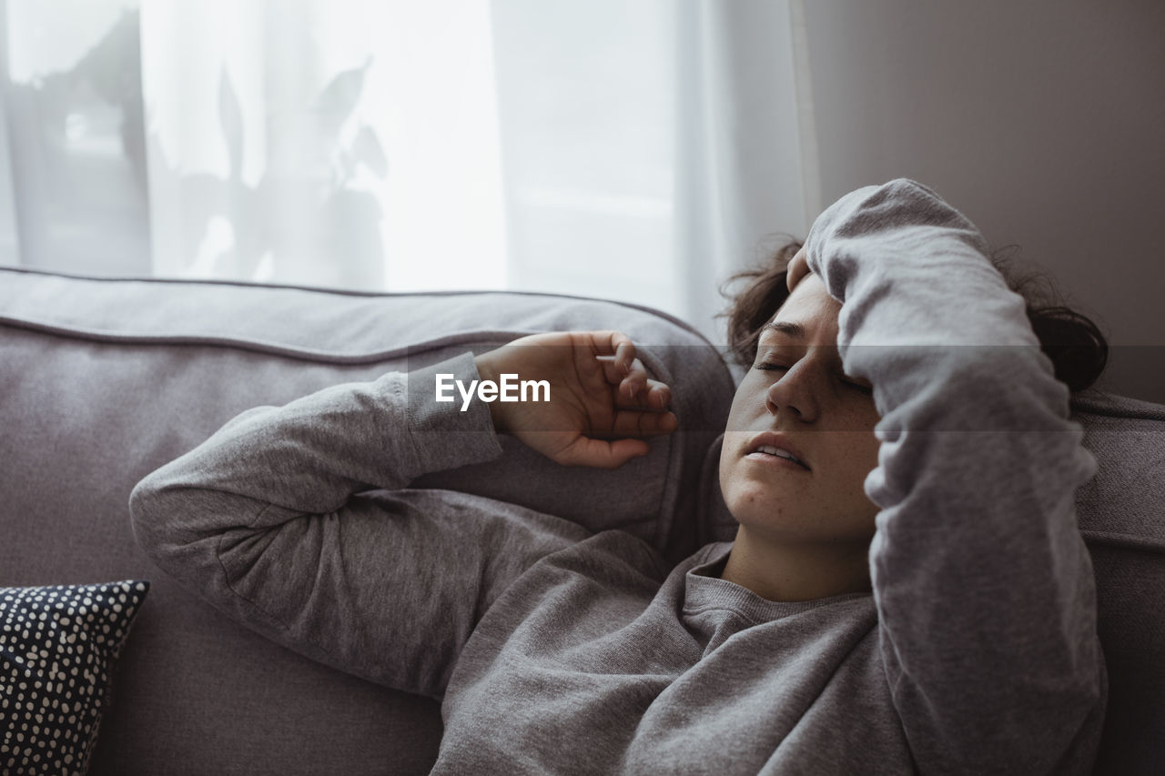 Close-up of woman having headache at home