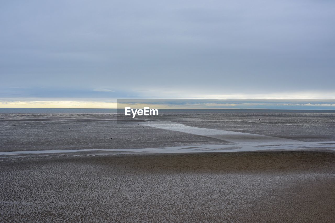 VIEW OF BEACH AGAINST SKY