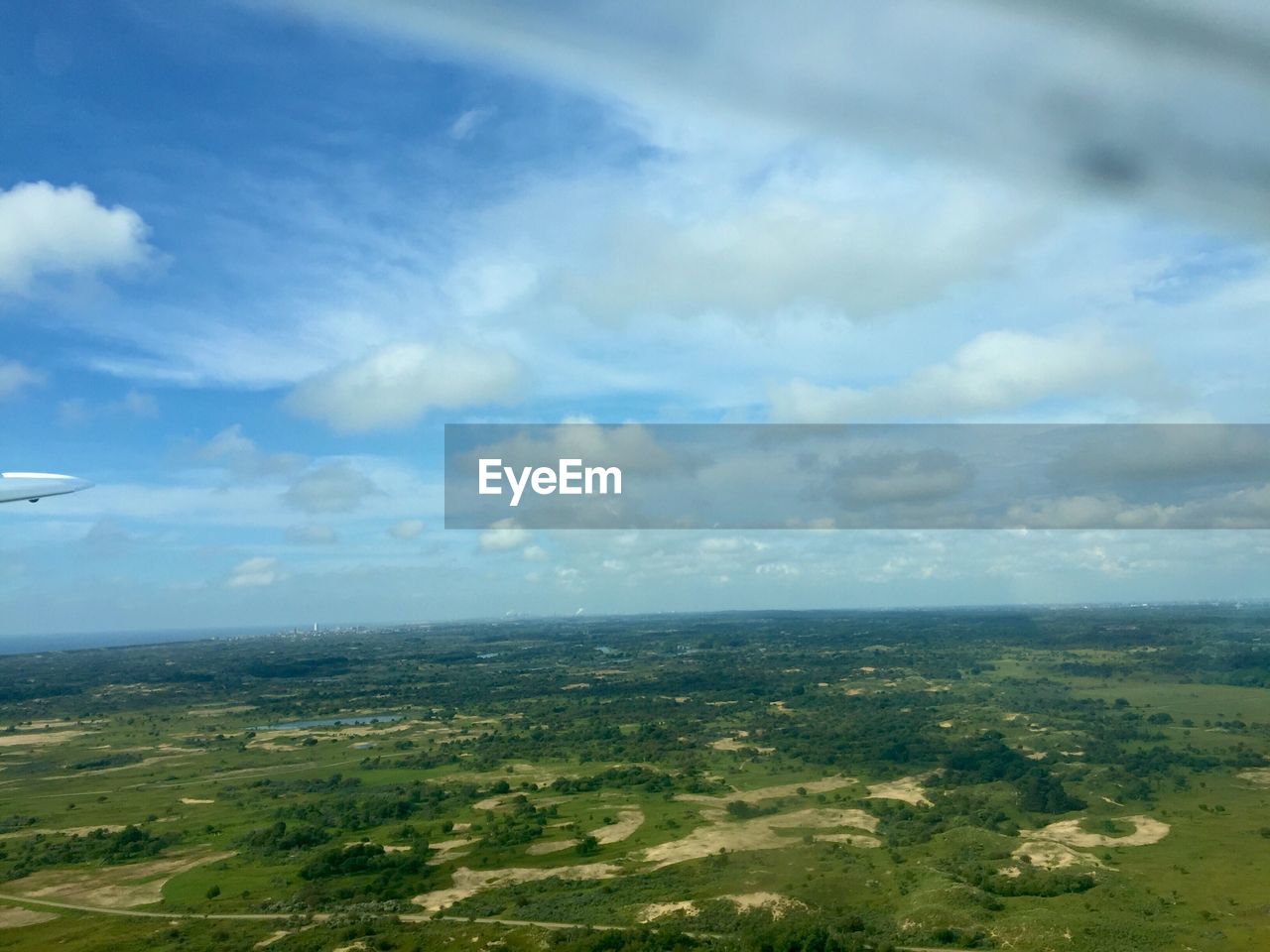 SCENIC VIEW OF LANDSCAPE AGAINST CLOUDY SKY