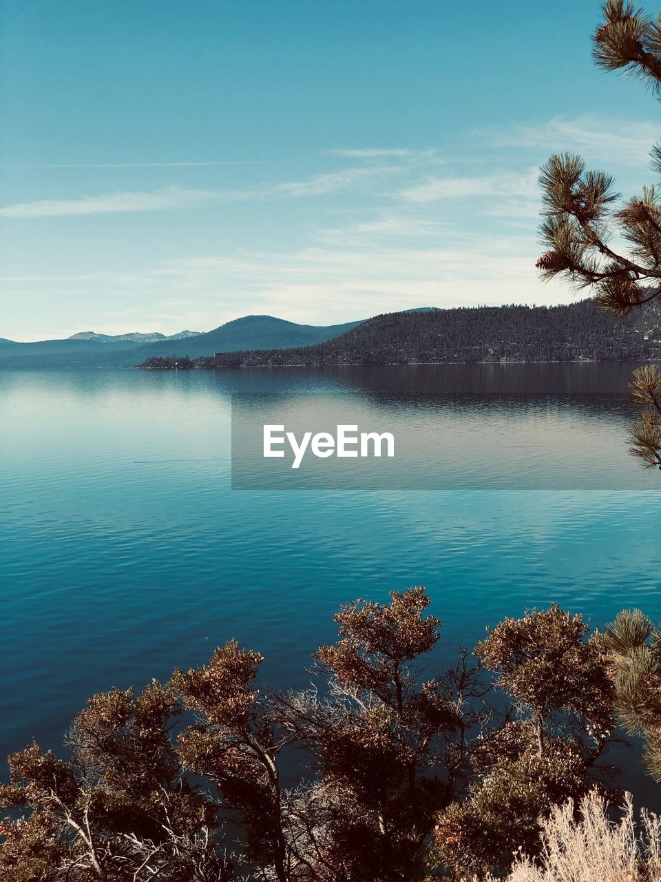 Scenic view of lake against blue sky