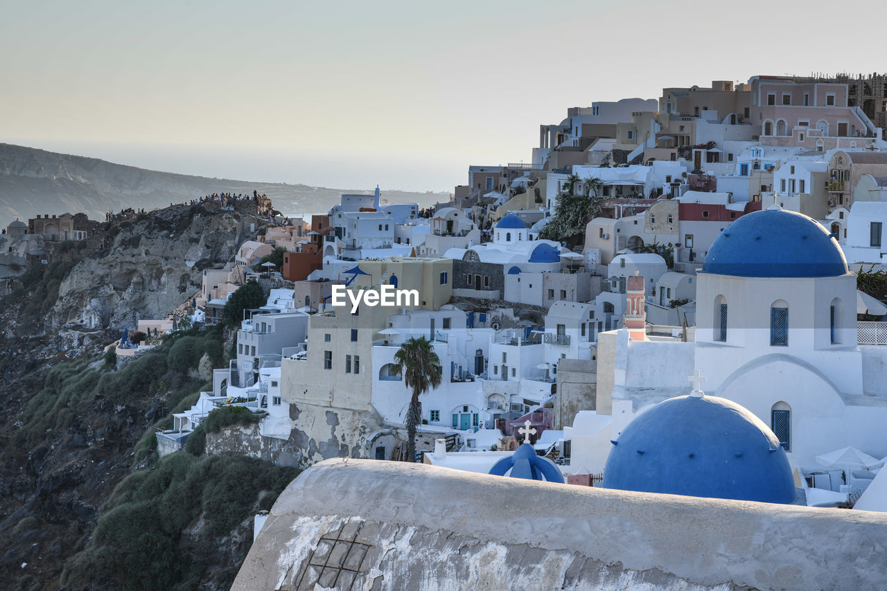 Buildings in city against clear sky. santorini