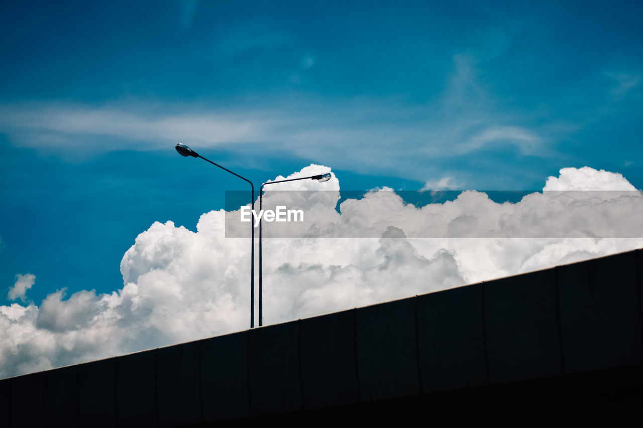 Low angle view of street light against sky