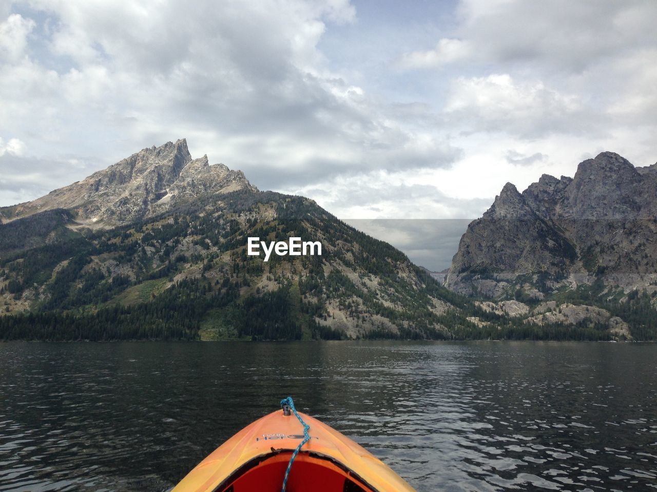 Scenic view of mountains against cloudy sky