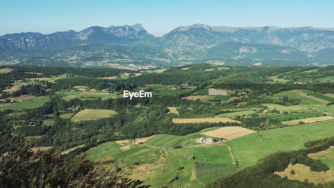 Aerial view of agricultural field against clear sky