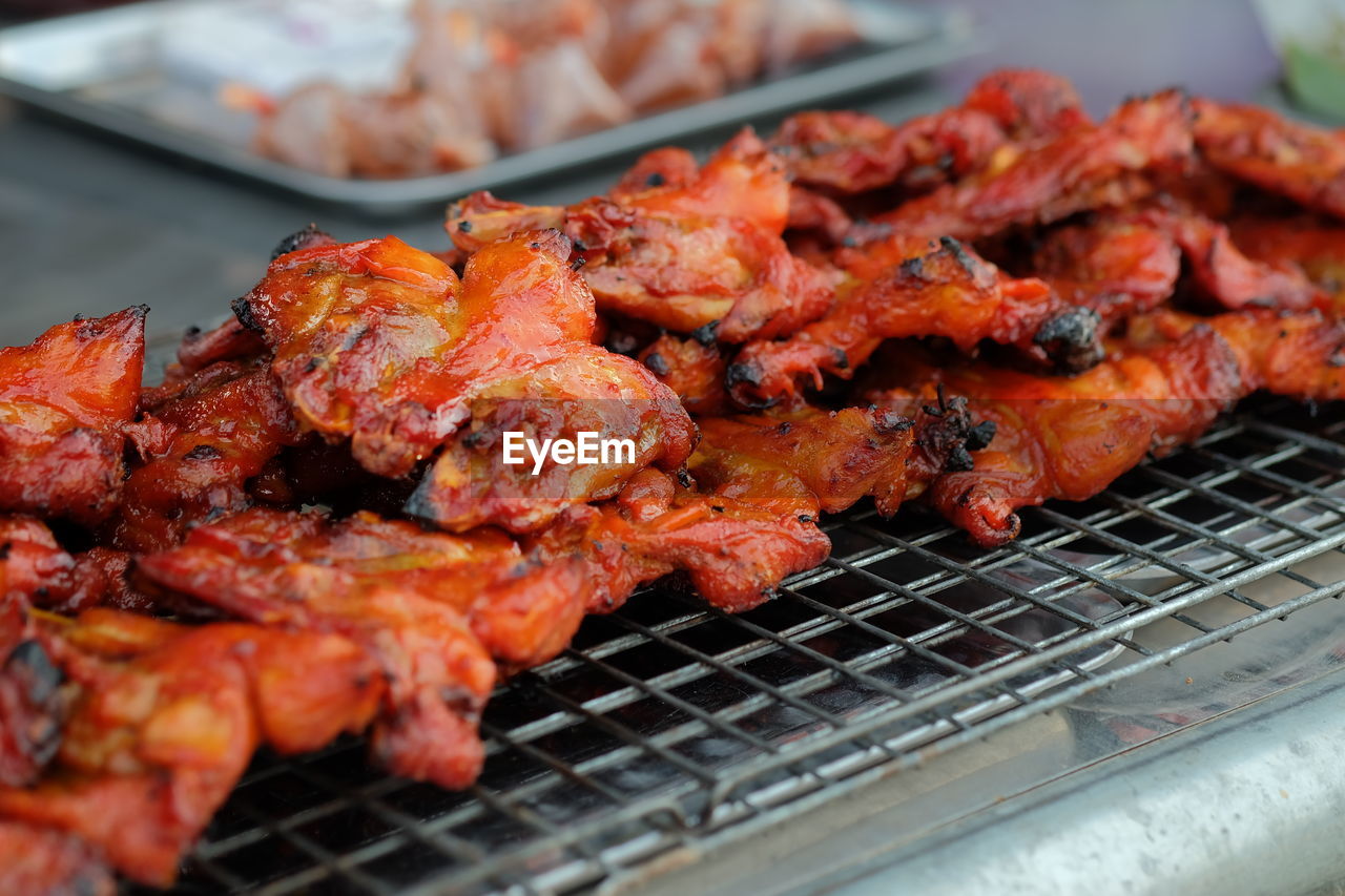 CLOSE-UP OF SEAFOOD ON BARBECUE GRILL