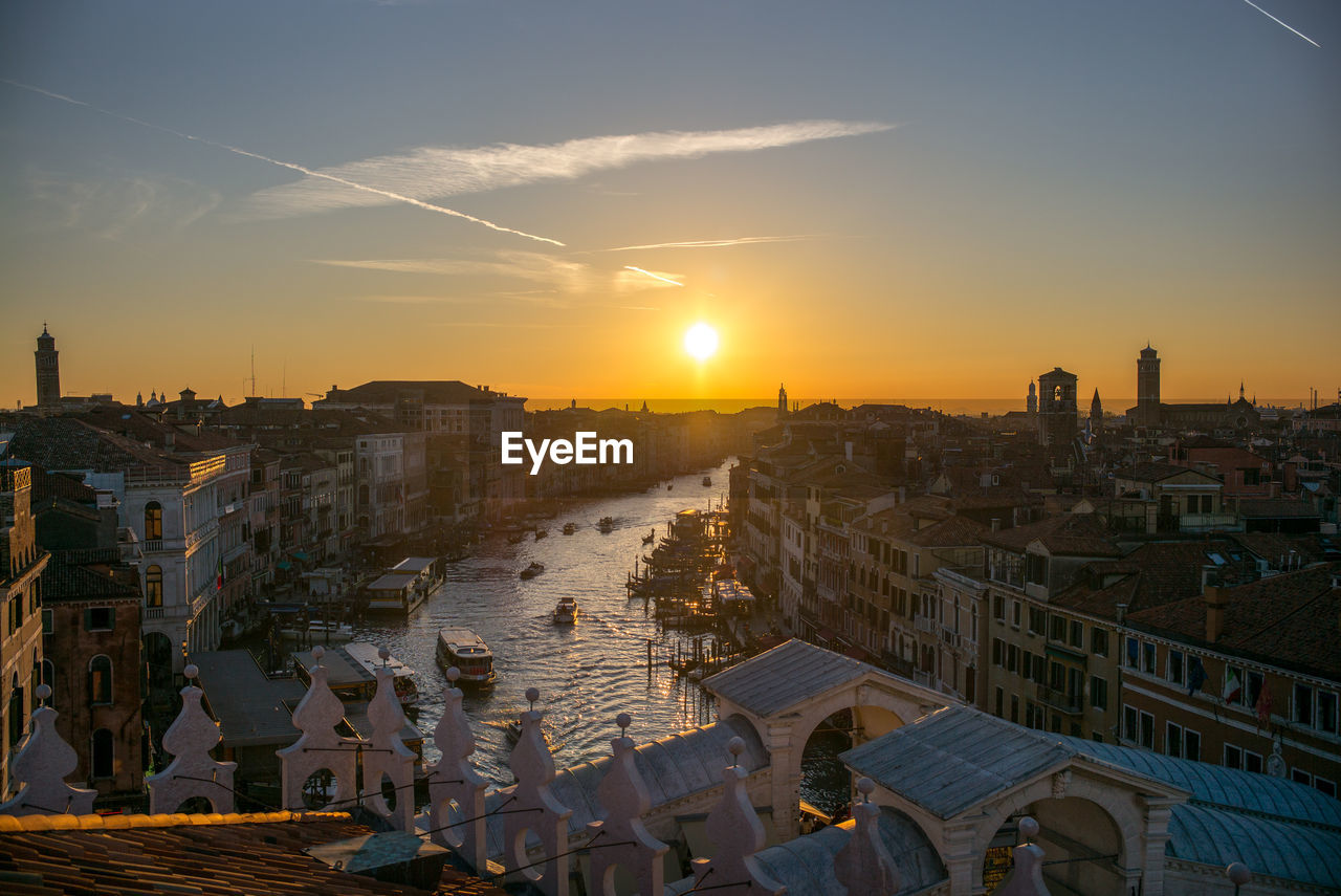 Cityscape against sky during sunset