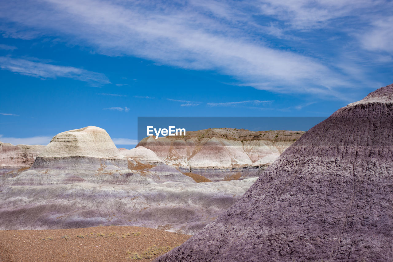 Rock formations on landscape against sky
