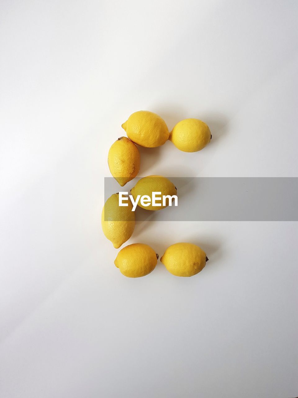 Close-up of lemons against white background