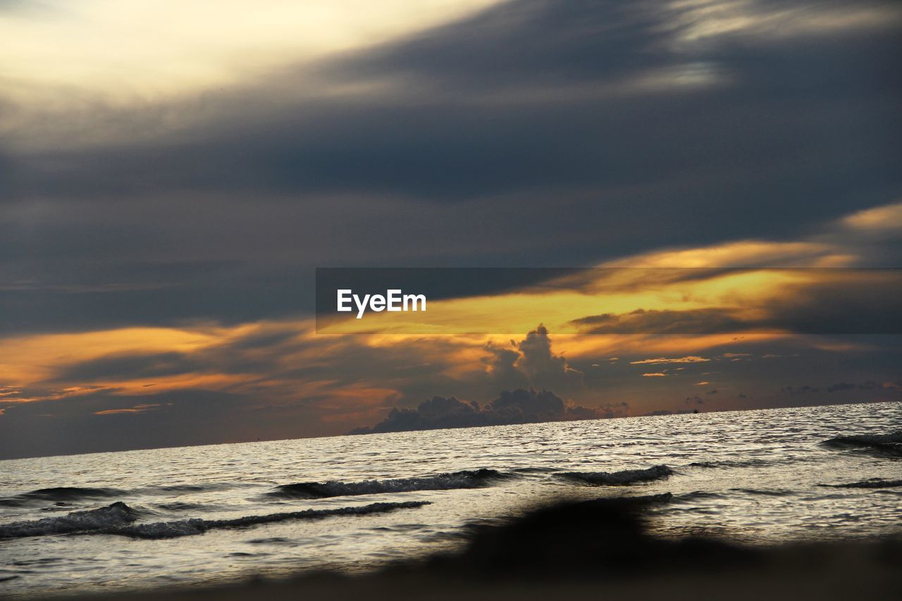 SCENIC VIEW OF SEA DURING SUNSET
