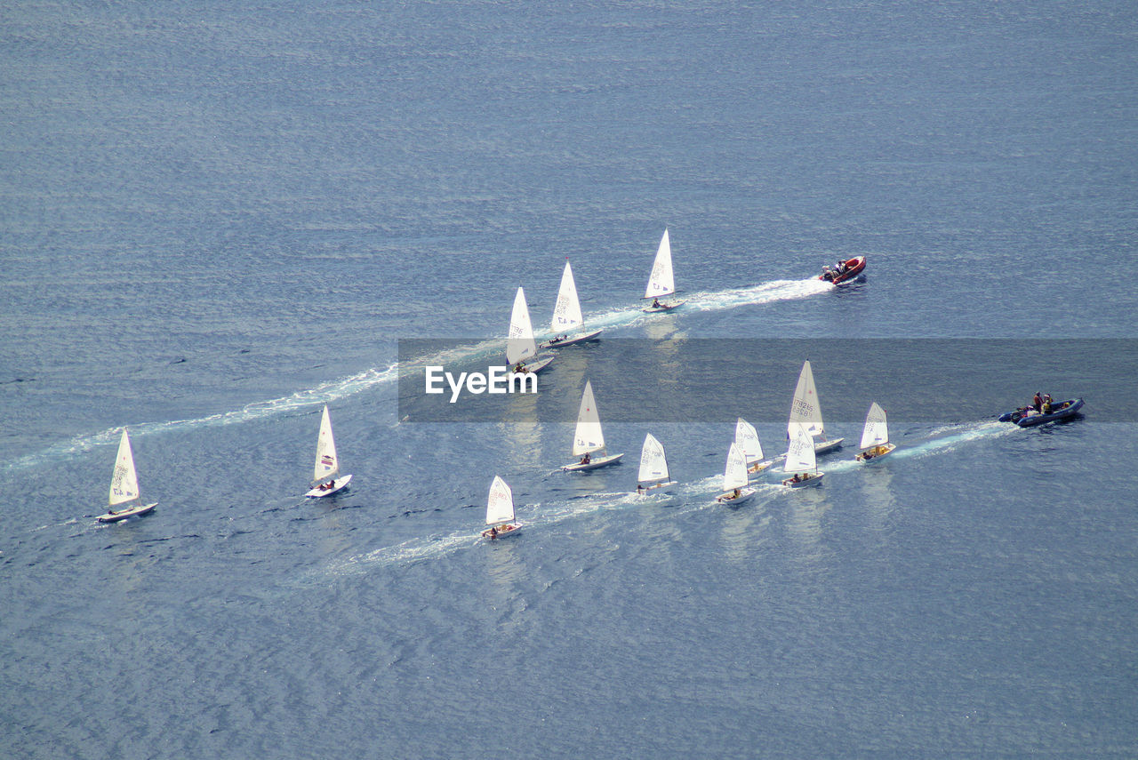 High angle view of sailboats sailing on sea