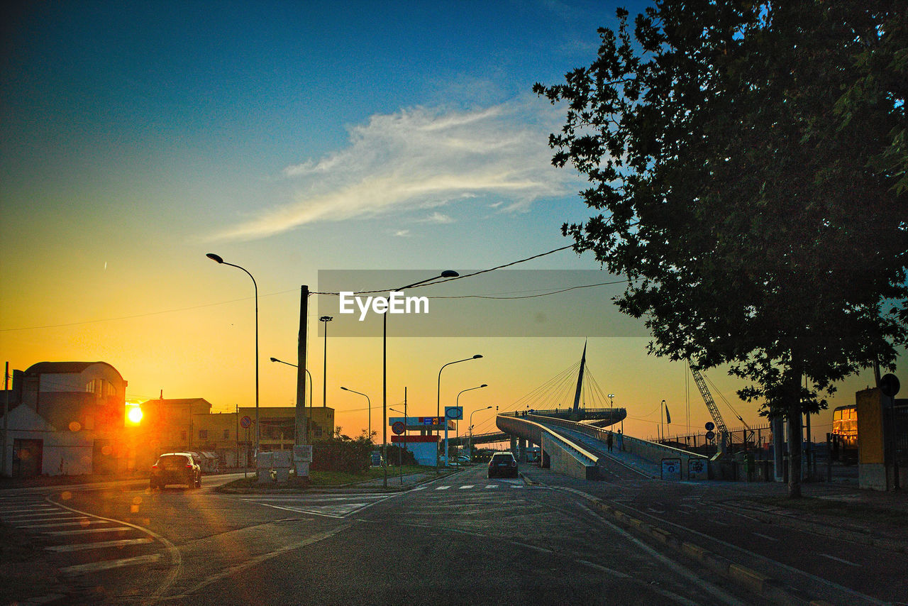 STREET AGAINST SKY AT SUNSET