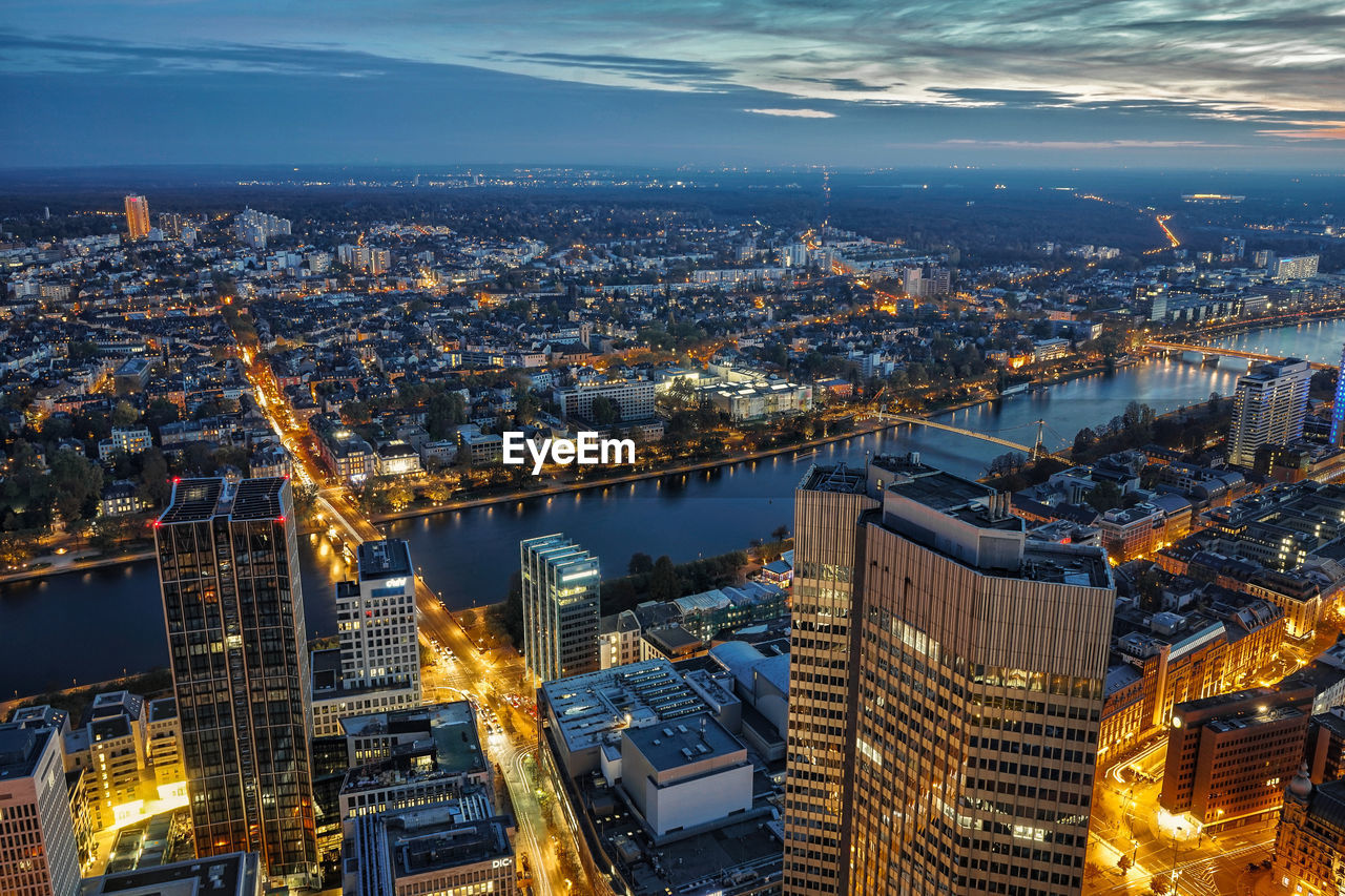 High angle view of illuminated buildings in city at night