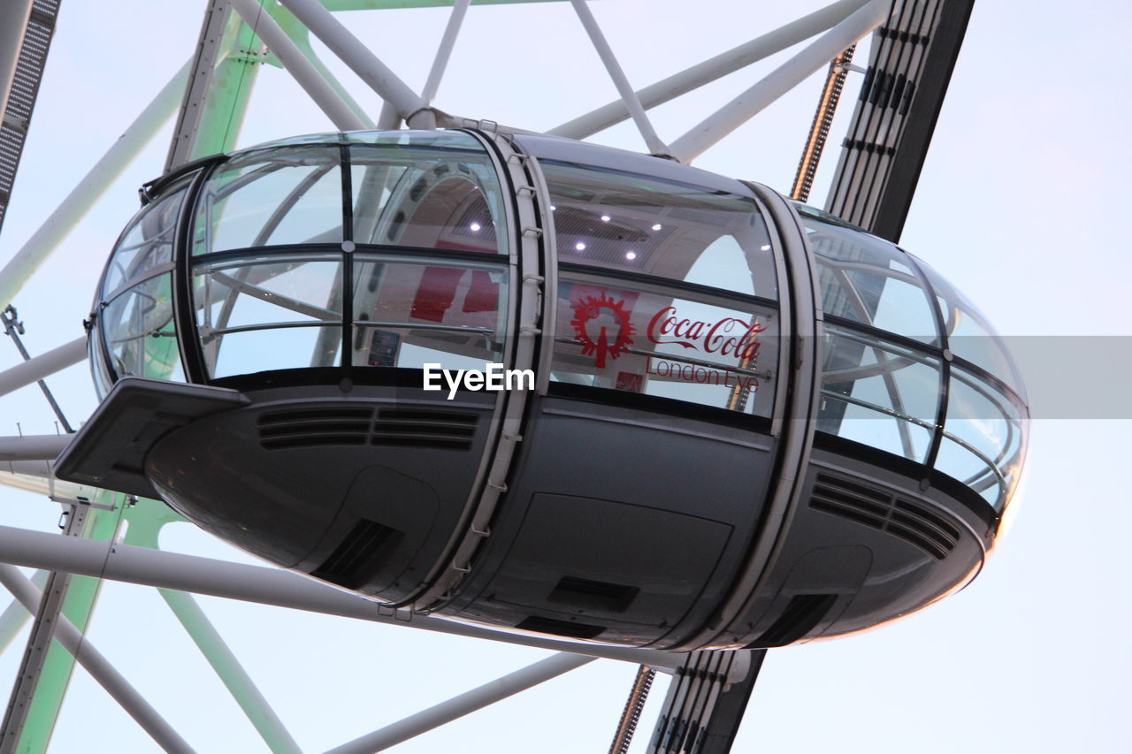 LOW ANGLE VIEW OF ROLLERCOASTER AGAINST SKY