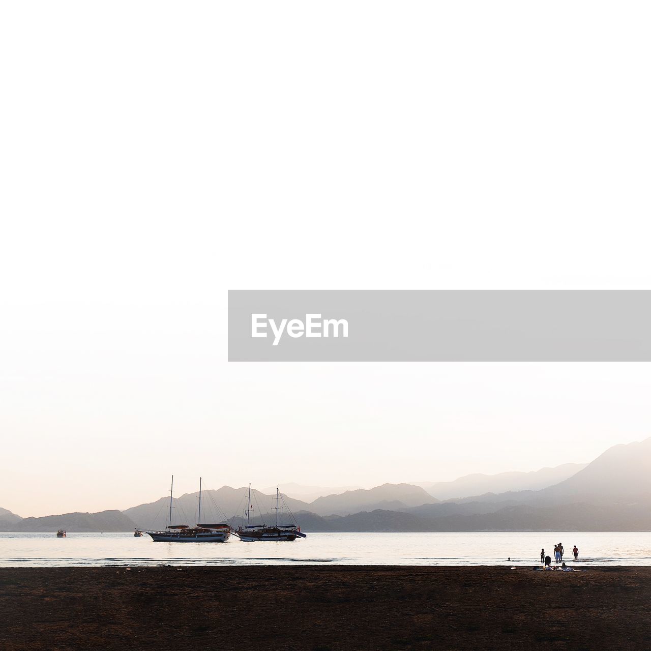 Distant shot of boat in misty morning