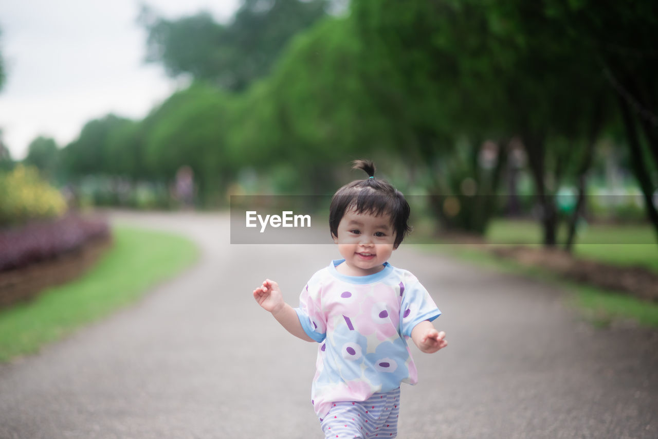 Portrait of cute girl standing outdoors