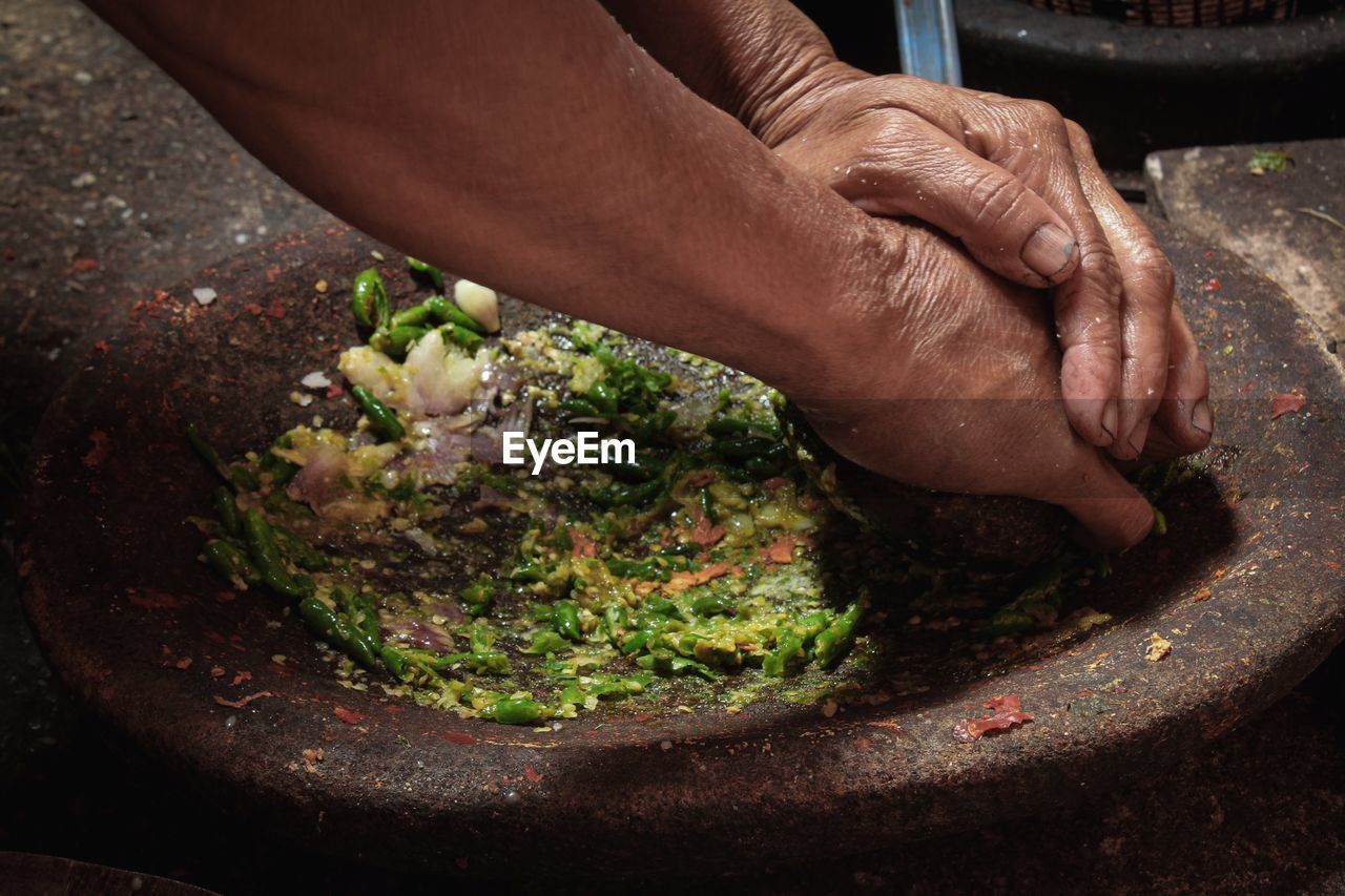 Close up hand grind spices in a traditional kitchen