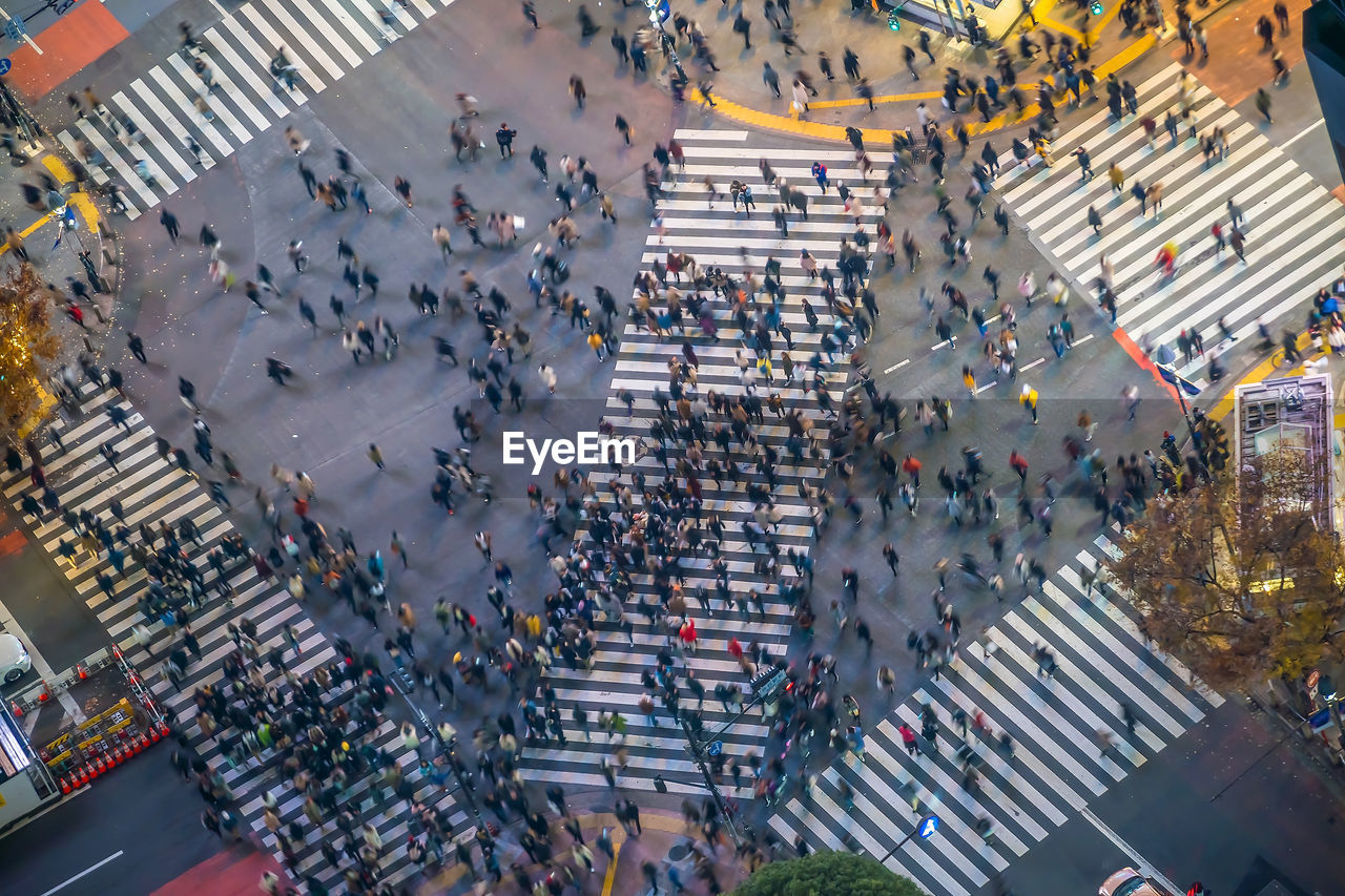 High angle view of people crossing street