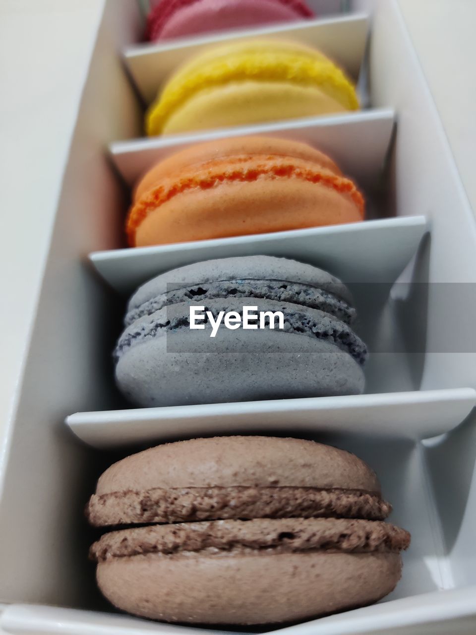 food, food and drink, variation, sweet food, in a row, sweet, no people, indoors, dessert, group of objects, baked, temptation, freshness, medium group of objects, still life, close-up, cake, store, order, studio shot, french food, snack, breakfast, meal, retail, multi colored