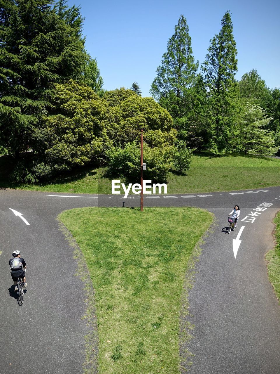 High angle view of people cycling on road