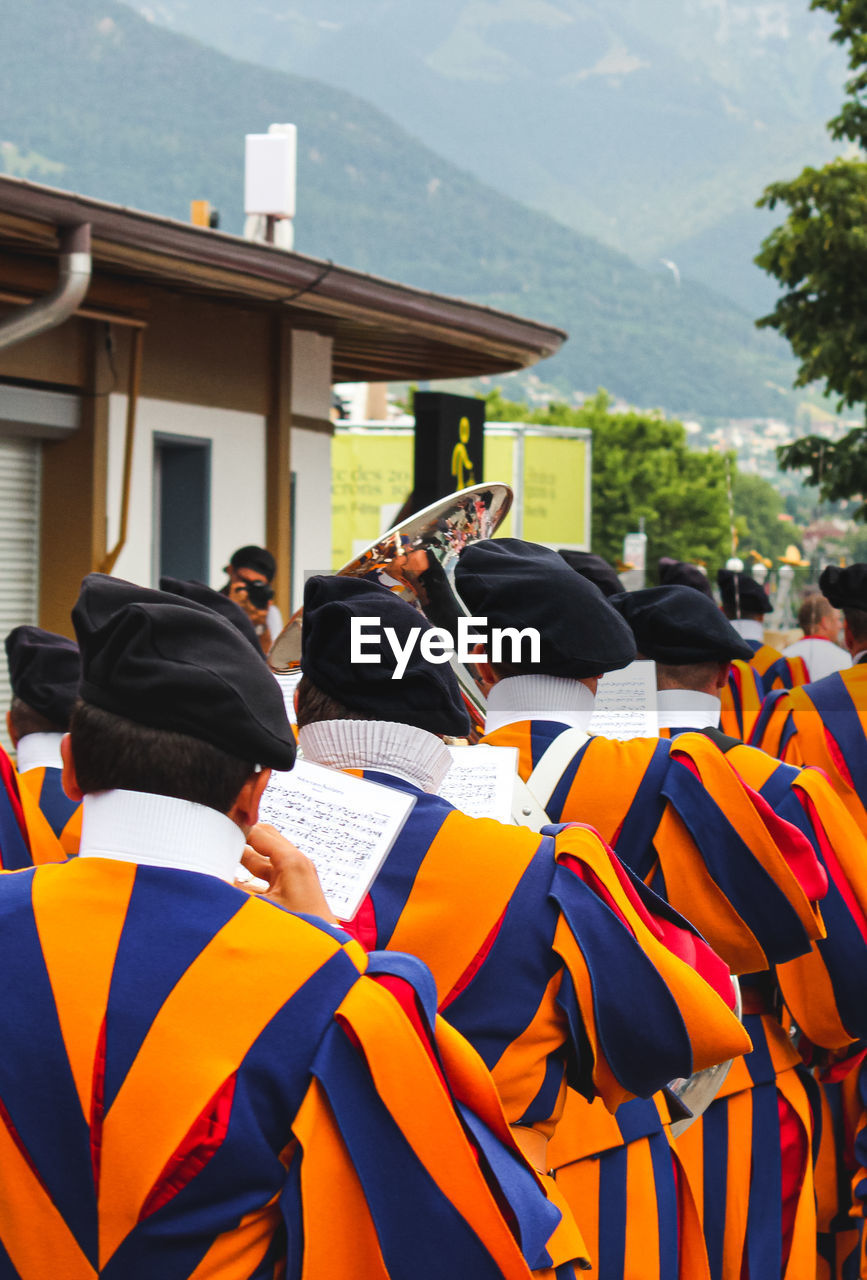 Rear view of marching band wearing uniforms