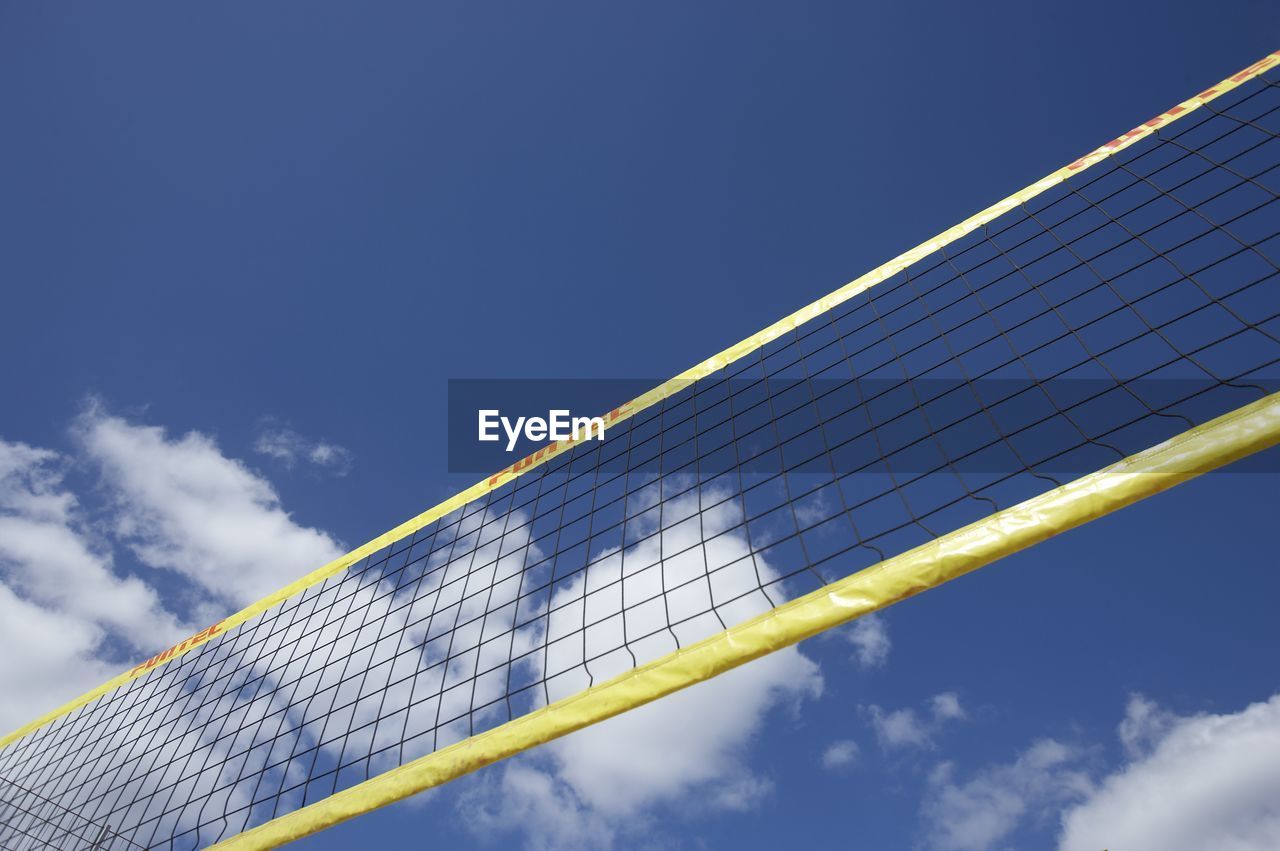 LOW ANGLE VIEW OF BASKETBALL COURT AGAINST SKY