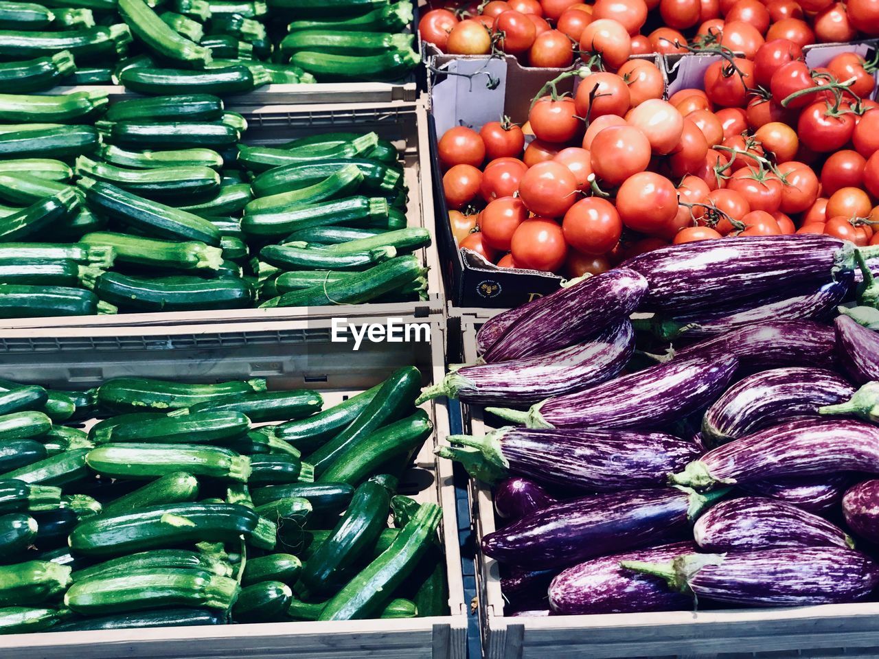 Fresh vegetable zucchini eggplant and tomatoes in vegetables market 