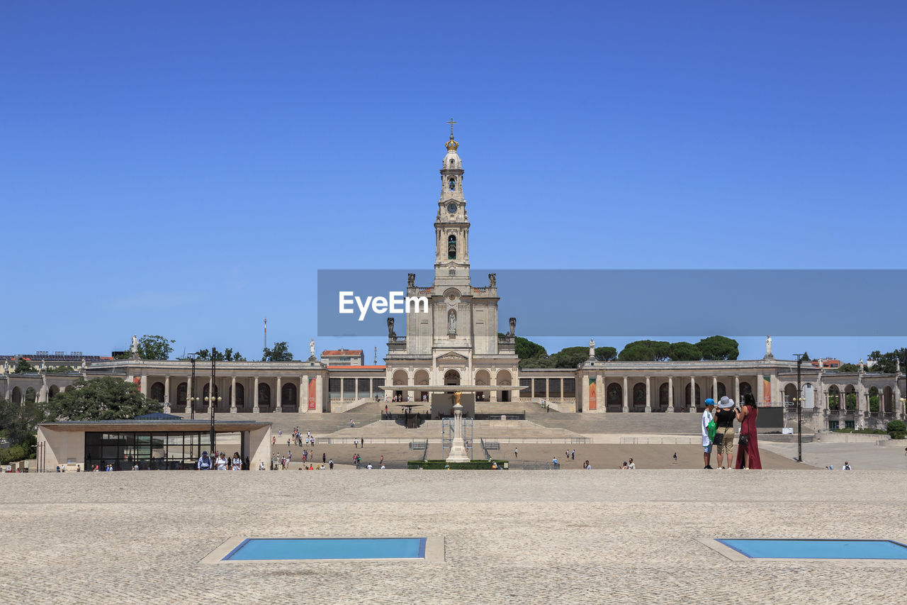 low angle view of historic building against clear blue sky