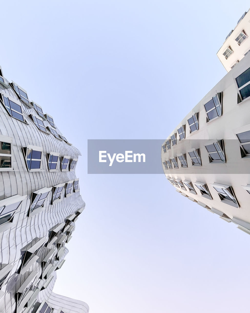 Low angle view of skyscraper against clear sky