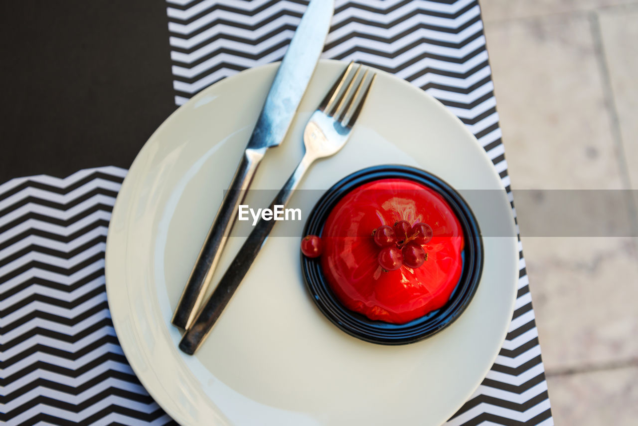 Directly above shot of red dessert in plate on table