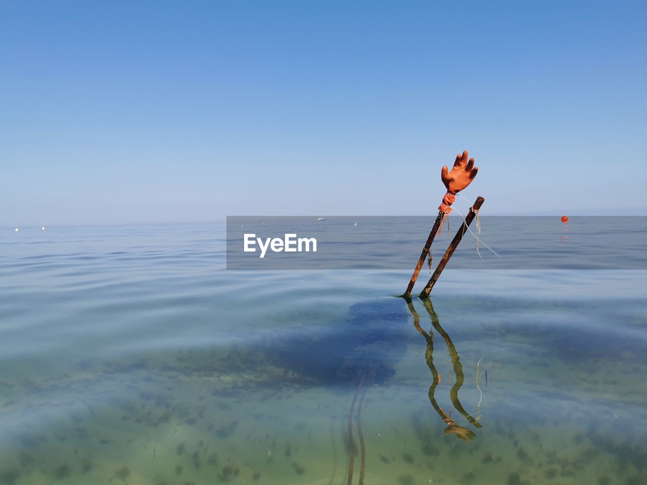 water, sea, sky, ocean, nature, shore, wave, blue, clear sky, beauty in nature, tranquility, coast, horizon, horizon over water, copy space, day, beach, land, one person, body of water, outdoors, scenics - nature, tranquil scene, sports, reflection, environment, sunny, wind, sunlight