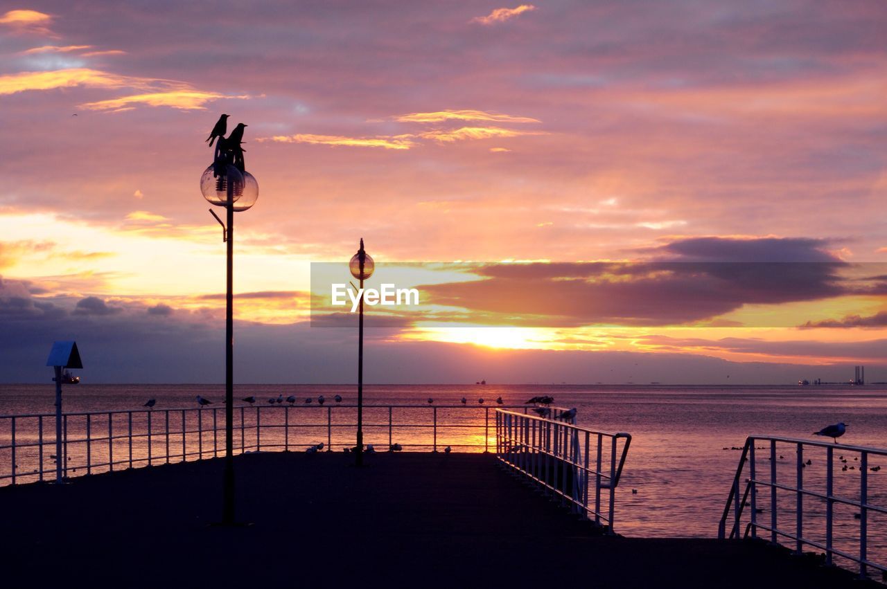 Scenic view of sea at sunset