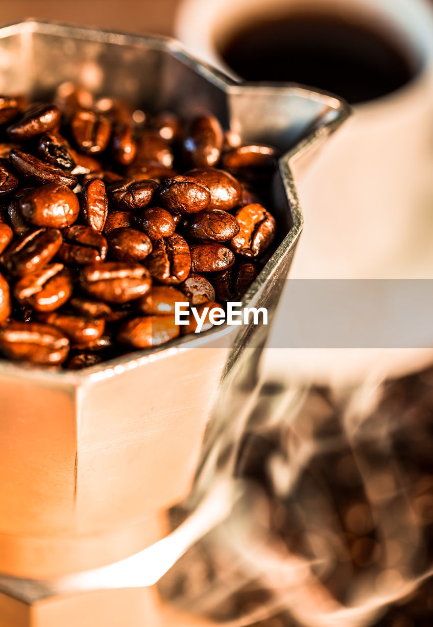 Close-up of coffee beans in espresso maker