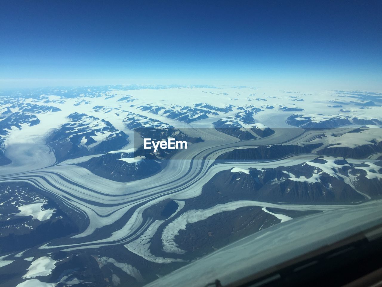 Aerial view of snow covered mountains