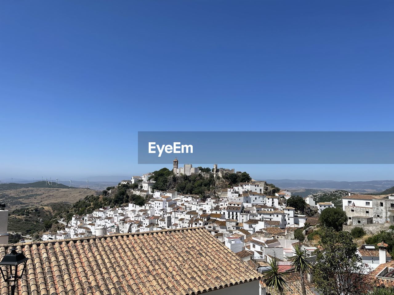 The white village of casares in southern spain against clear blue sky