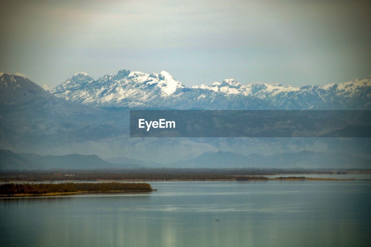 SCENIC VIEW OF SNOWCAPPED MOUNTAIN AGAINST SKY