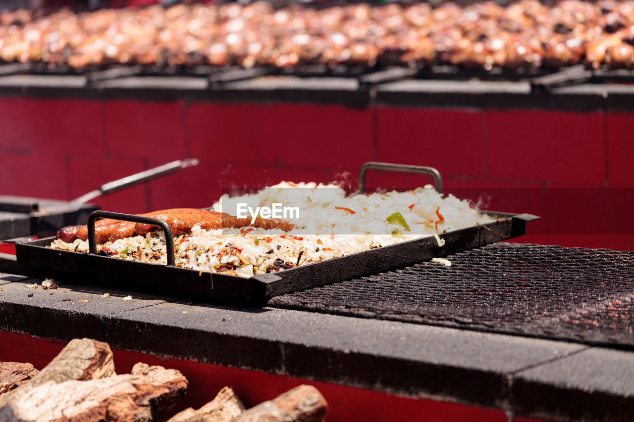 CLOSE-UP OF MEAT ON BARBECUE