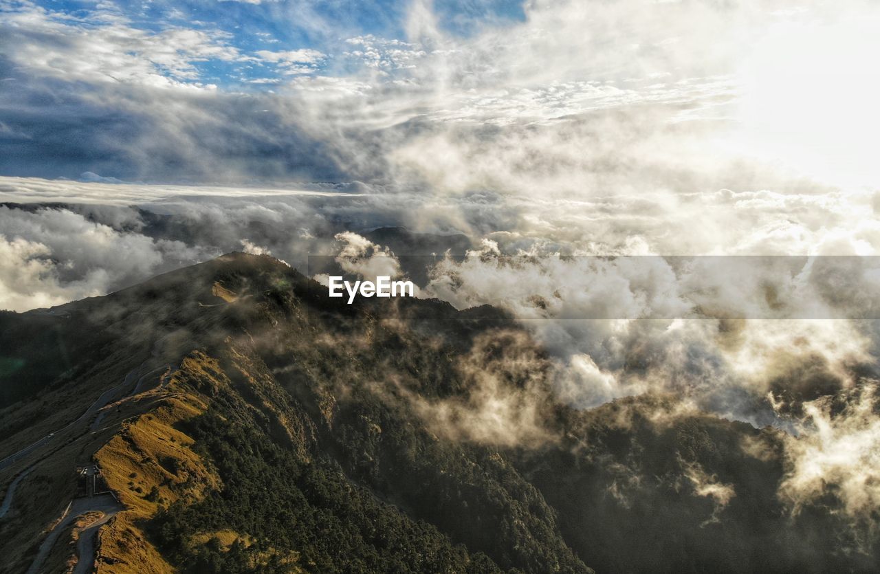 Aerial view of majestic mountains against sky