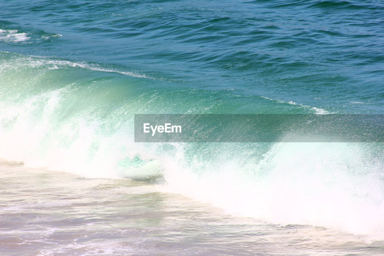 Waves splashing on beach