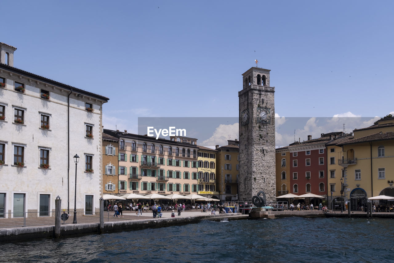 architecture, built structure, building exterior, water, building, city, travel destinations, town, sky, waterway, travel, cityscape, nature, tourism, tower, transportation, history, the past, clear sky, landmark, nautical vessel, waterfront, river, mode of transportation, no people, vehicle, old, outdoors, bridge, blue, day, place of worship, religion, urban area, residential district, sunny