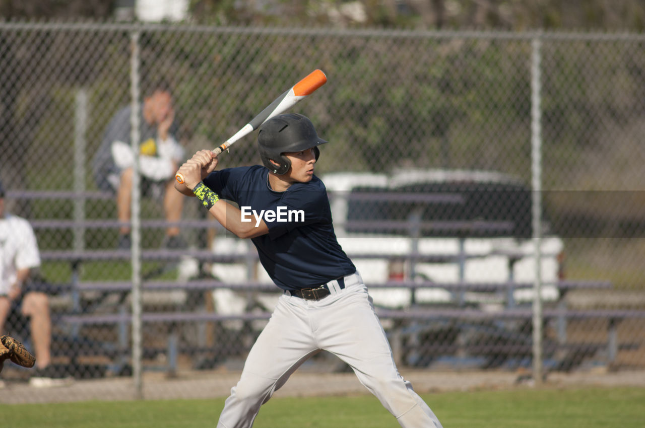 Teen baseball player ready to swing in the batters box