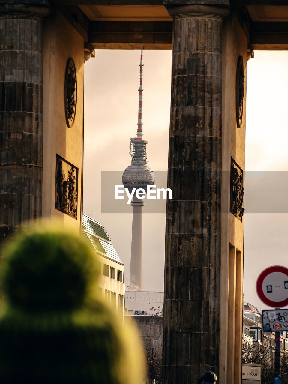 View of communications tower and buildings in city