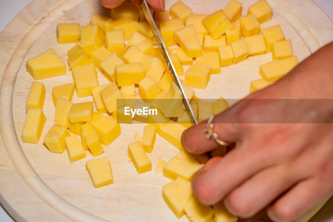 High angle view of man preparing food on cutting board