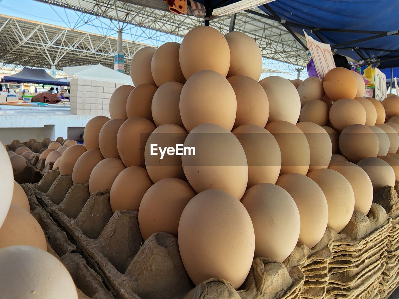 egg, food, food and drink, large group of objects, freshness, business, healthy eating, abundance, wellbeing, no people, retail, animal egg, indoors, market, container, raw food, arrangement, business finance and industry, order, organic, brown, nature, in a row, agriculture, fragility